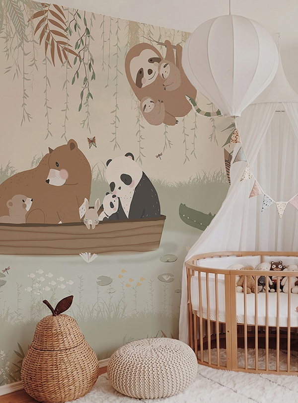 Custom made-to-measure nursery mural wallpaper called Family Time, featuring sloths, pandas and bears in soft sage green and neutral tones, installed in a boho woodland baby room