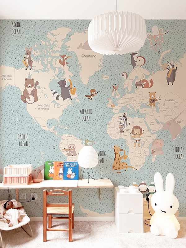 Children's wall mural with musical world map – animals playing instruments across continents, in soft blue-grey and beige tones, for kids' rooms